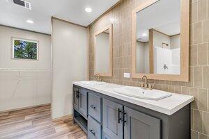 119 Silver King Ave, Cross, SC 29436 - full bath featuring double vanity, tile walls, a sink, and wood finished floors