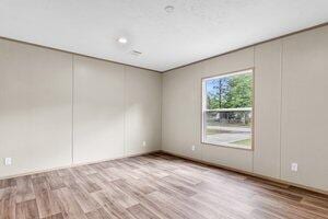 119 Silver King Ave, Cross, SC 29436 - spare room featuring a decorative wall and wood finished floors