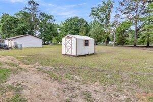 119 Silver King Ave, Cross, SC 29436 - view of yard featuring an outdoor structure and a shed