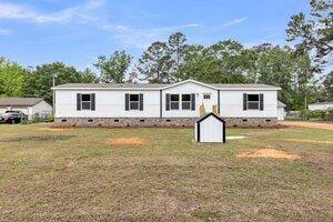119 Silver King Ave, Cross, SC 29436 - manufactured / mobile home with a carport, a front yard, and crawl space