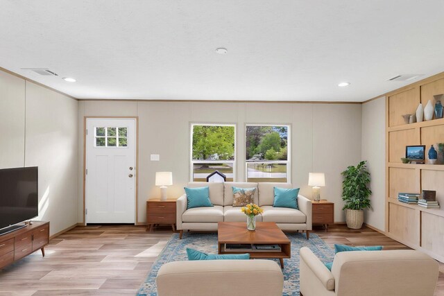 119 Silver King Ave, Cross, SC 29436 - living area with recessed lighting, visible vents, ornamental molding, and light wood-type flooring