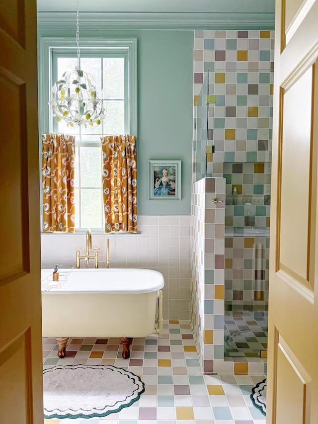 bathroom with a washtub and tile walls