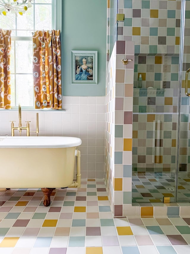 bathroom with plus walk in shower and tile walls