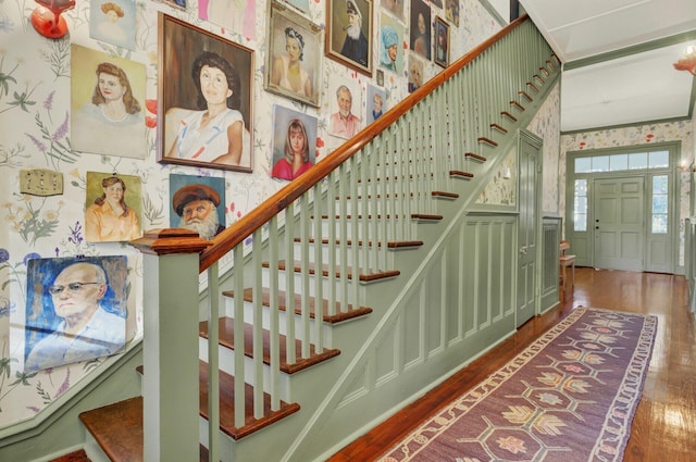 stairway with hardwood / wood-style floors