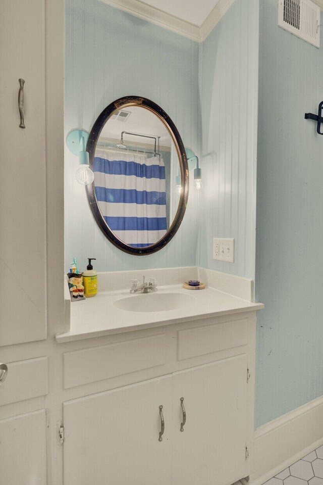 bathroom featuring tile patterned floors and vanity