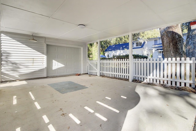 view of patio featuring a garage and a carport