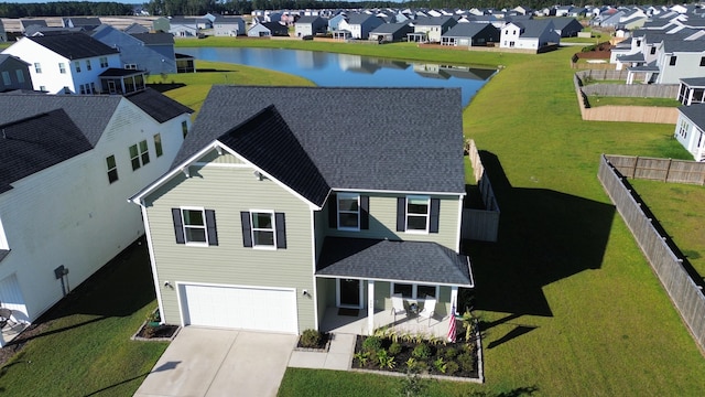 birds eye view of property with a water view