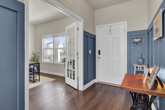 entrance foyer with dark hardwood / wood-style floors