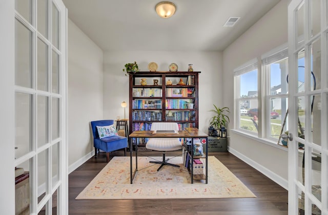 home office with french doors and dark hardwood / wood-style flooring