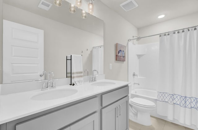 full bathroom featuring toilet, shower / bath combo, tile patterned flooring, and vanity