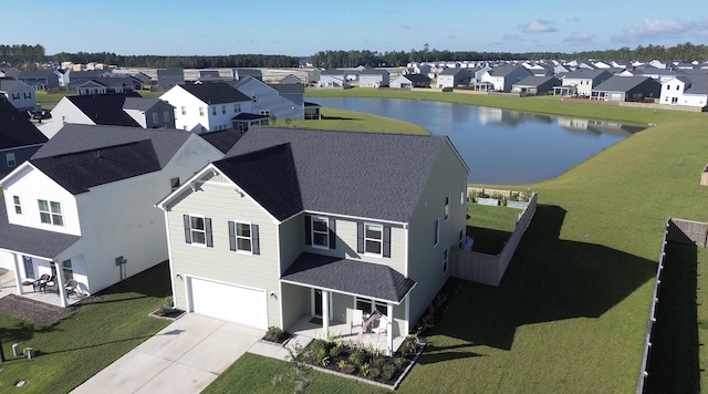 drone / aerial view with a water view