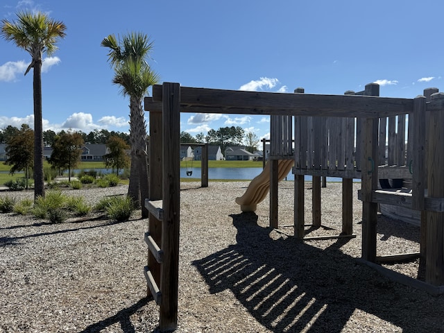 view of playground with a water view