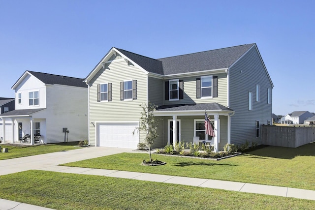 front of property featuring a front lawn and a garage