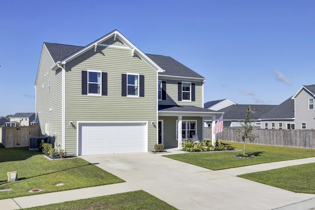 front of property featuring central AC, a front lawn, and a garage