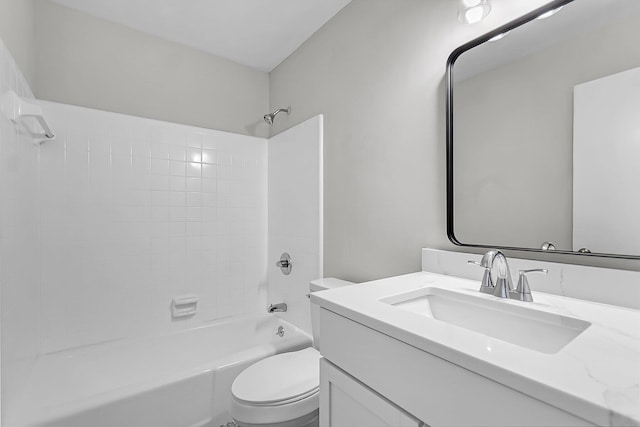 bathroom featuring vanity, toilet, and shower / washtub combination