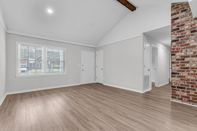 unfurnished living room featuring high vaulted ceiling, light wood-style flooring, baseboards, beam ceiling, and visible vents