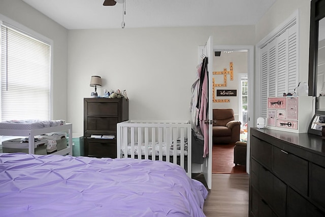 bedroom featuring a closet, ceiling fan, and hardwood / wood-style flooring