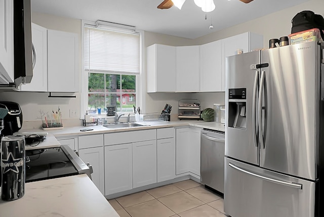 kitchen with white cabinets, sink, appliances with stainless steel finishes, and ceiling fan