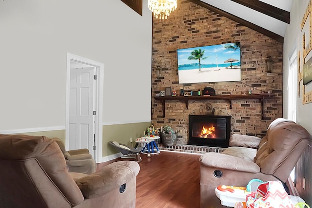 living room with a brick fireplace, high vaulted ceiling, beam ceiling, a chandelier, and hardwood / wood-style flooring