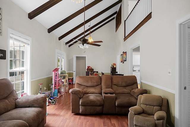 living room with high vaulted ceiling, beam ceiling, ceiling fan, and hardwood / wood-style floors