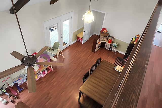 interior space with wood-type flooring, french doors, and beamed ceiling