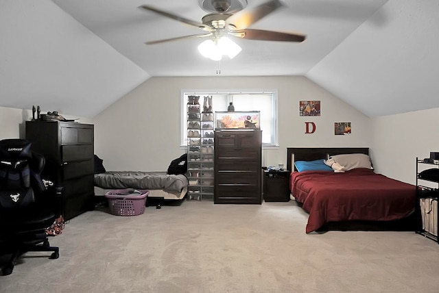 carpeted bedroom with lofted ceiling and ceiling fan