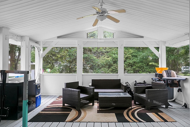 sunroom / solarium with ceiling fan and vaulted ceiling