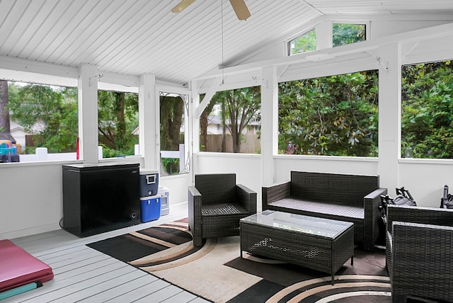 sunroom / solarium featuring lofted ceiling and ceiling fan