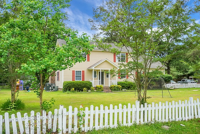 colonial inspired home with a front lawn