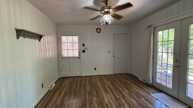 doorway with dark wood-style flooring, a healthy amount of sunlight, french doors, and visible vents