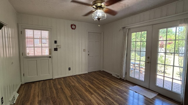 entryway featuring a ceiling fan, french doors, wood finished floors, and visible vents
