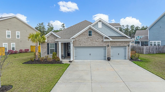 view of front of home featuring fence, concrete driveway, a front yard, a shingled roof, and brick siding