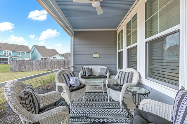 exterior space featuring outdoor lounge area, a ceiling fan, and fence