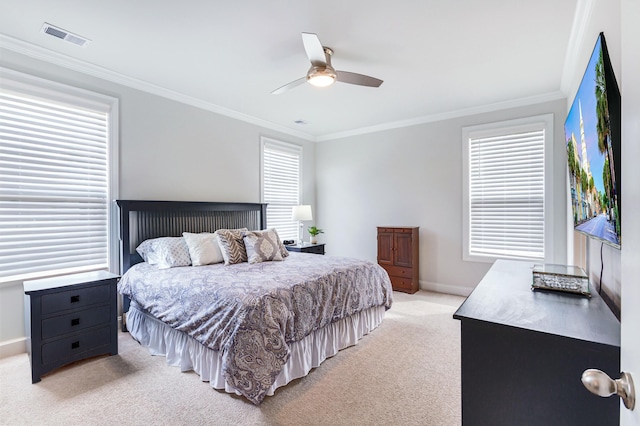 bedroom with visible vents, baseboards, light colored carpet, and crown molding