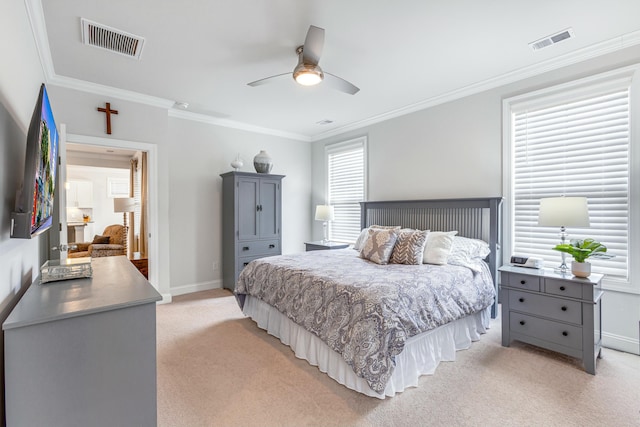 bedroom featuring light carpet, visible vents, and multiple windows