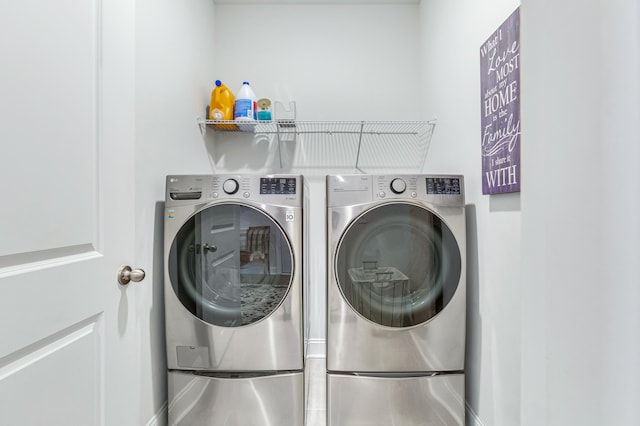 clothes washing area with laundry area and washing machine and dryer