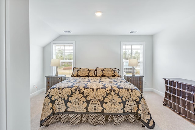 bedroom featuring visible vents, baseboards, and carpet