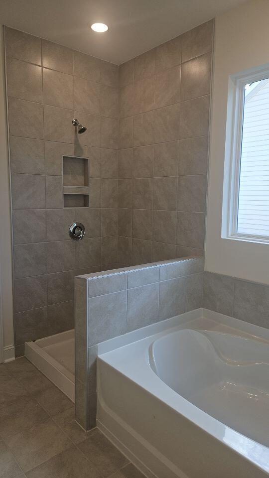 259 Huguenot Trl, Huger, SC 29450 - bathroom featuring a bath, a tile shower, tile patterned floors, and recessed lighting