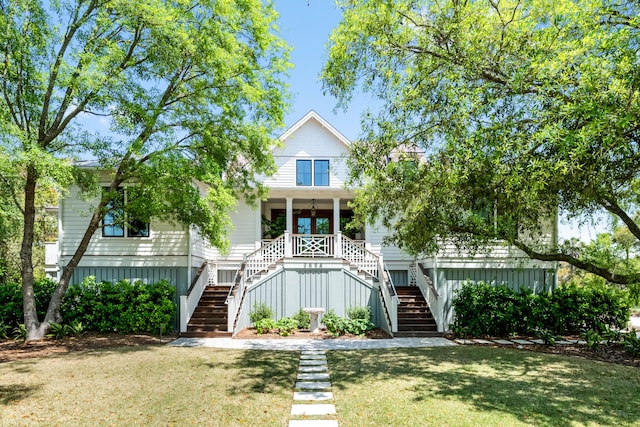 2538 Helmsman Rd, Johns Island, SC 29455 - view of front of home with stairway, a front lawn, and a porch