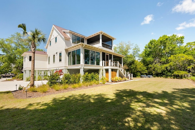 2538 Helmsman Rd, Johns Island, SC 29455 - rear view of property with a balcony, stairs, a sunroom, and a yard
