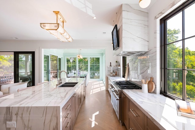 2538 Helmsman Rd, Johns Island, SC 29455 - kitchen with a sink, double oven range, wall chimney range hood, and a healthy amount of sunlight