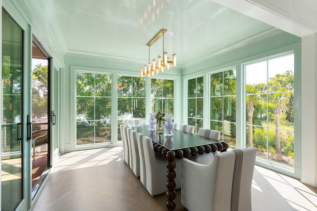 2538 Helmsman Rd, Johns Island, SC 29455 - sunroom with crown molding, a wealth of natural light, and an inviting chandelier