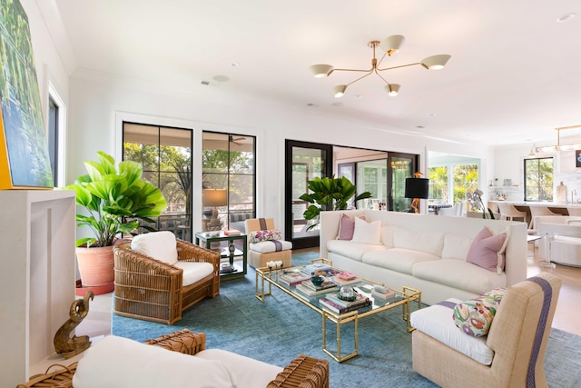 2538 Helmsman Rd, Johns Island, SC 29455 - living room featuring a healthy amount of sunlight and a notable chandelier