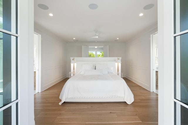 2538 Helmsman Rd, Johns Island, SC 29455 - bedroom featuring a decorative wall, light wood-type flooring, and recessed lighting
