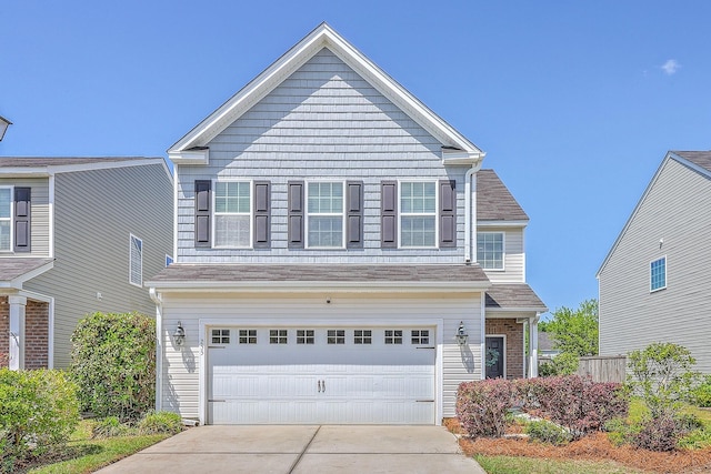view of front of home featuring driveway and a garage