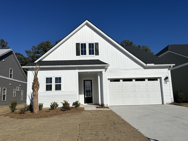 modern inspired farmhouse with a garage