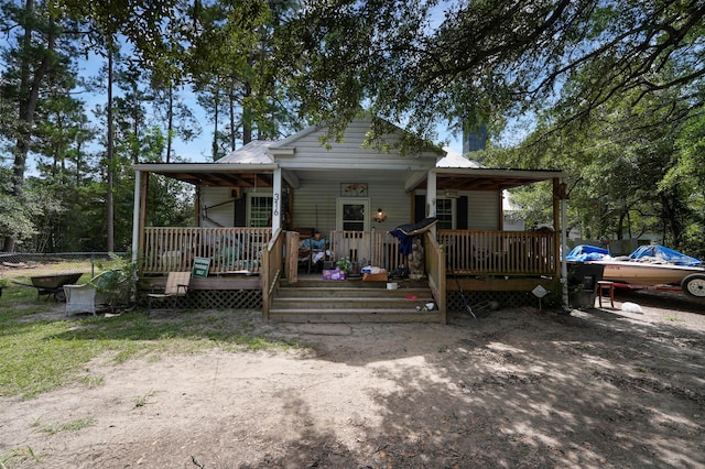 bungalow featuring a wooden deck