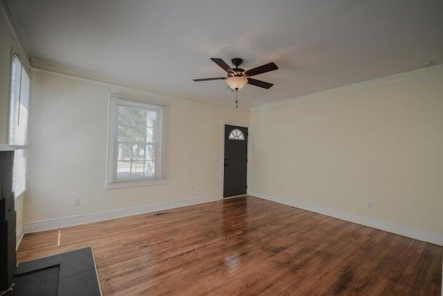 unfurnished living room featuring ceiling fan, hardwood / wood-style flooring, and crown molding