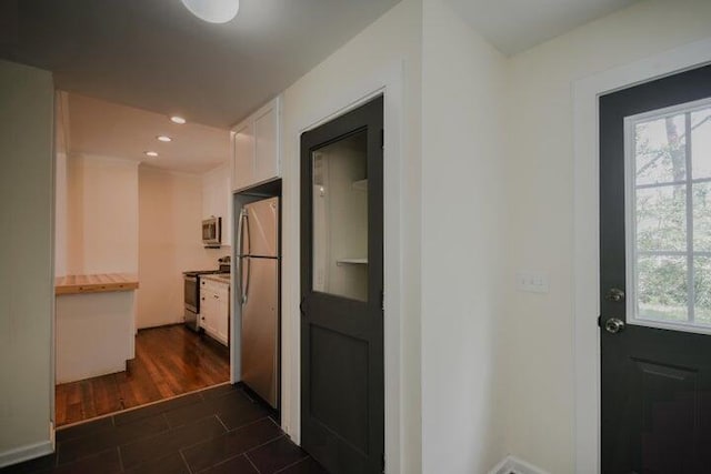 hall with dark hardwood / wood-style flooring