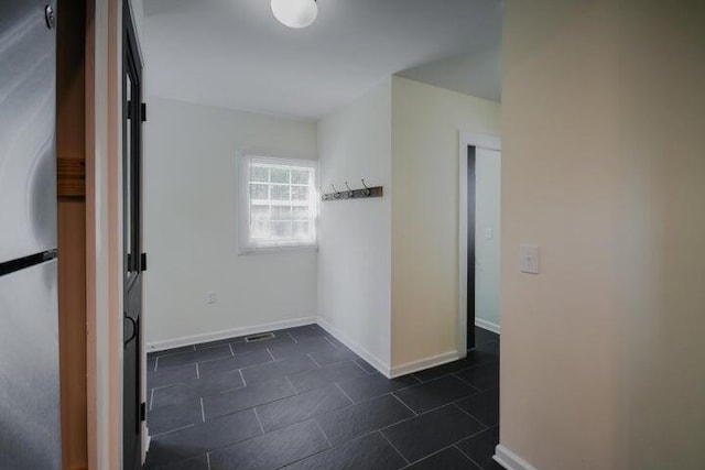 interior space featuring dark tile patterned flooring